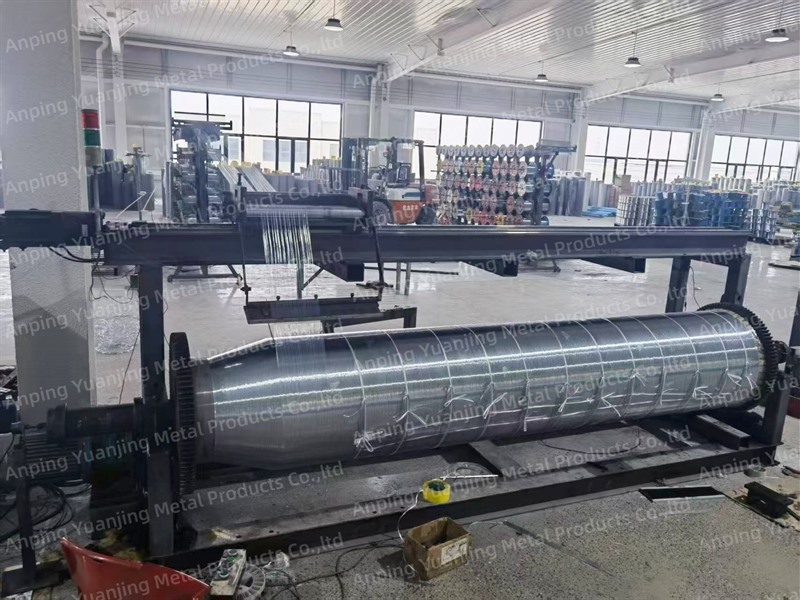 Stainless steel wire mesh roll being produced on an automatic weaving machine